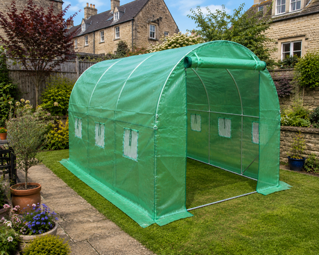 3x2m walk-in polytunnel greenhouse with roll-up door in a UK garden