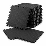 A stack of black interlocking foam floor mats with a textured diamond pattern, shown on a clean white background.